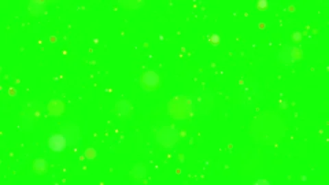 Floating golden particles drifting against vibrant green screen background Vídeo Stock 344416369