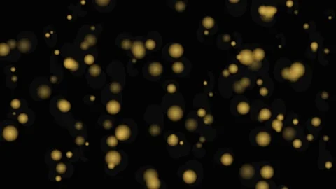 Floating golden particles drifting slowly in dark void abstract background .. Видео 341960105