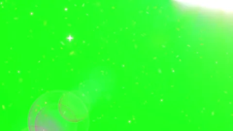 Floating Golden Sparkles Over A Vibrant Green Screen Background With Magical Видео 339124064
