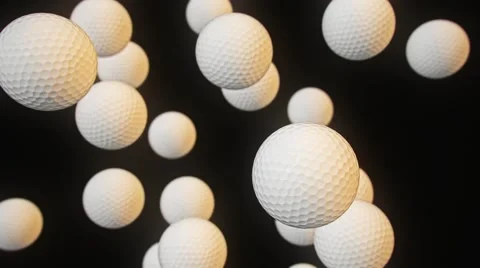 Floating Golf Balls Against Black 库存影片 65992652