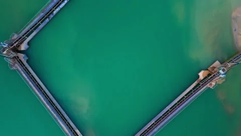 Floating gravel pit platform in turquoise water, aerial view Stock Footage 340919829
