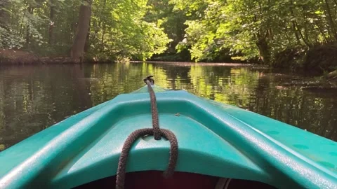 Floating with a green paddle boat on river branch in Leipzig Stock-Footage 319768504