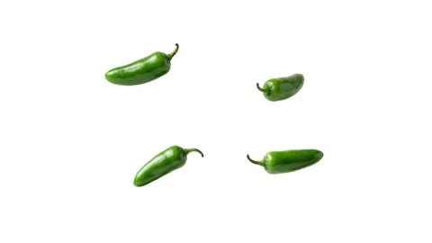 Floating green peppers isolated on white Stock Footage 339340656