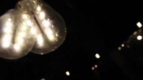 Floating hanging incandescent Light Bulbs Stock Footage 27415595