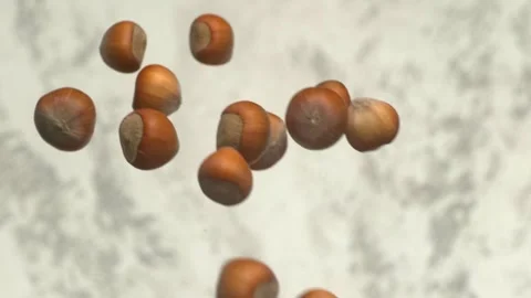 Floating Hazelnuts in a Captivating and Dynamic Background Display, Full of Stockbeeldmateriaal 286713449
