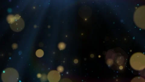 Floating heart shaped particles swirling within golden bokeh light beams dark Stock Footage 344190126