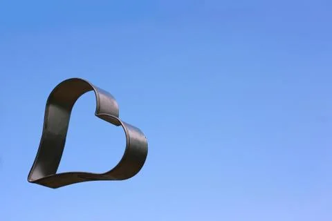 Floating heart with sky background Stock Photos
