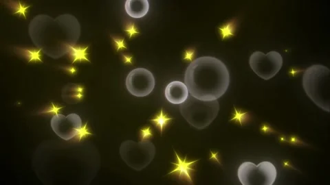 Floating hearts and glowing yellow stars rising against dark background motion Stockbeeldmateriaal 345101769