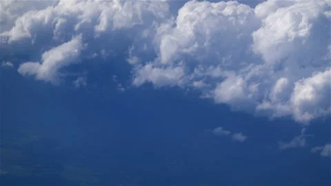 Floating high above white fluffy clouds Stock Footage 205020309