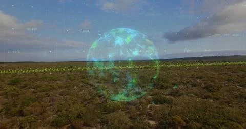 Floating holographic sphere hovering over scrubland, with polygon fragments and Stock Photos