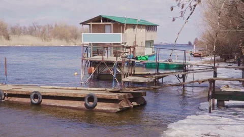 Floating house on the river at the pier Stock Footage 102345398