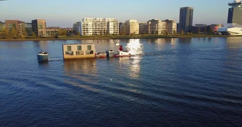 Floating house towed past the EYE Filmmuseum on the IJ Vidéo 71297026