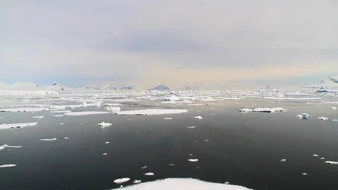 Floating ice in Antarctica with mountains in the background 1 Stock Footage 88285040