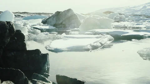 Floating ice chunks in a glacier lagoon in Iceland Stock-Footage 348027264
