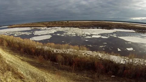 Floating of ice. Floating of ice on spring river at sunset. Stock Footage 123353160