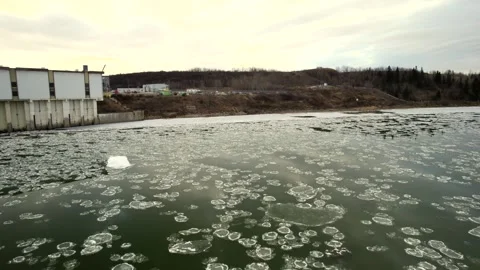 Floating Ice on the North Saskatchewan River Stock Footage 257286502