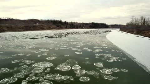 Floating Ice on the North Saskatchewan River Stock Footage 257286556