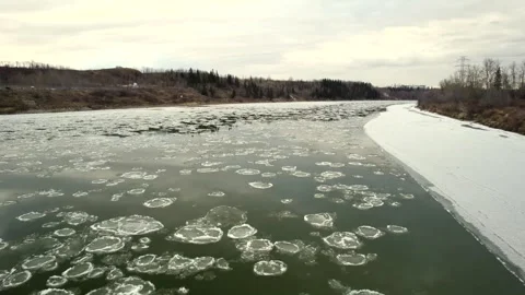 Floating Ice on the North Saskatchewan River Stock Footage 257286558