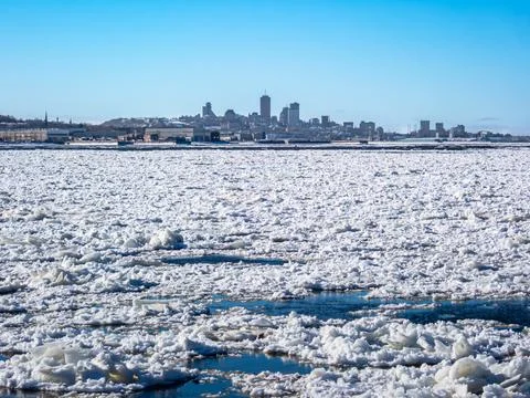 Floating ice on St-Lawrence river with a view of Quebec city in background... Stock Photos