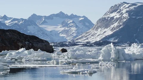 Floating icebergs with mountains in the background Stock Footage 113268023