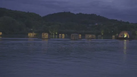 Floating Illuminated Lantern Cubes on River Water at Night Stock-Footage 343552679