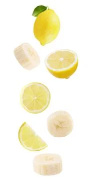Floating isolated on white background lemon fruits and bananas Stock Photos