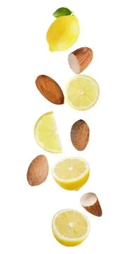 Floating isolated on white background lemon fruits and almonds Foto stock