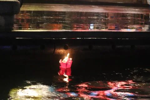 Floating Lantern with City Reflections Stock Photos