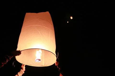 Floating lantern event at night time Stock Photos