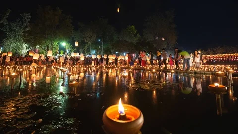 Floating lanterns and People in Yee Peng Festival or Loy Krathong (Zoom-In) Stock Footage 98918396