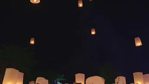 Floating lanterns, hot-air balloons Loy Krathong Festival in Chiang Mai Thailand Stock Footage 314810944