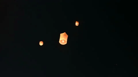 Floating lanterns in the night sky. Launching Sky Lantern. Yee Peng Festival, Lo Stock Footage 153401532