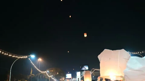 Floating lanterns in the night sky. Launching Sky Lantern. Yee Peng Festival, Lo Stock Footage 157726610