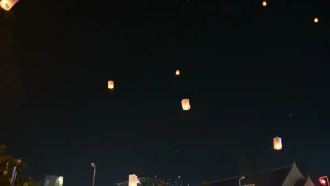 Floating lanterns in the night sky. Launching Sky Lantern. Yee Peng Festival, Lo Stock Footage 159803486