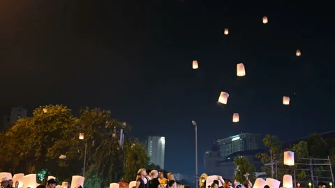 Floating lanterns in the night sky. Launching Sky Lantern. Yee Peng Festival, Lo Stock Footage 160674884
