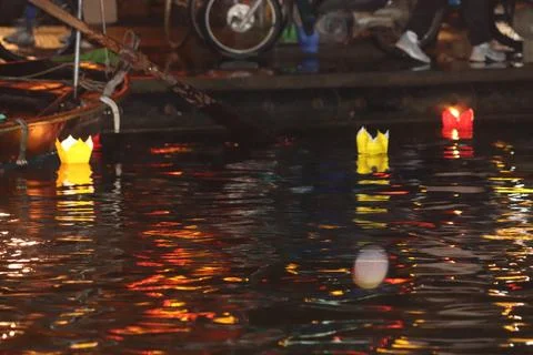 Floating Lanterns on a Reflective River Stock Photos