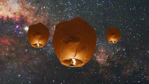 Floating Lanterns in Starry Sky. Magical Lanterns Under the Stars. Stock Footage 306330228