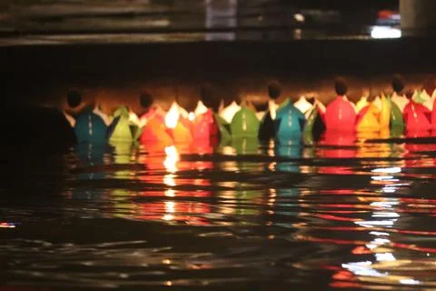  Floating Lanterns on Water at Night Foto stock