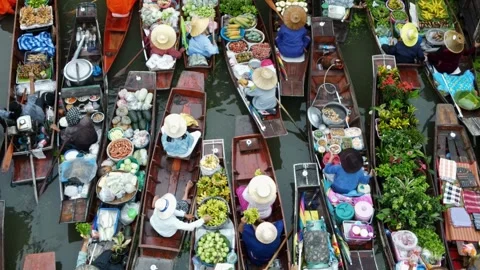 Floating market on small boats serving vegetables and food. 4K Footage Stock Footage 245594945
