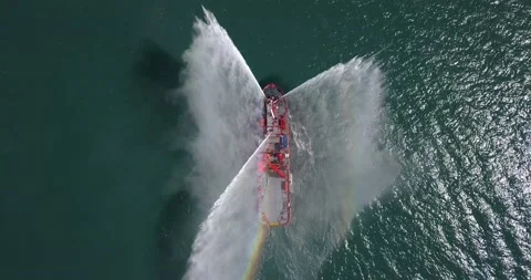 A floating modern ship sprays jets of water Stock-Footage 134262299