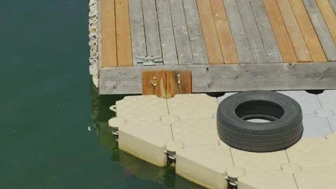 Floating modular dock system with rubber tire fender Stock-Footage 336151353