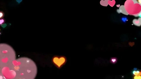 Floating multicolored glowing hearts animation against deep black background 動画素材 345102879