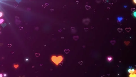 Floating multicolored neon hearts drifting slowly across dark purple background Stock Footage 343813299
