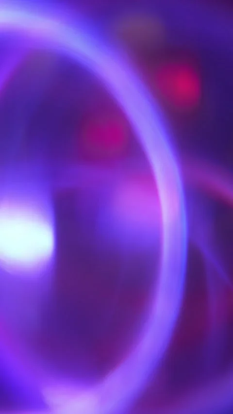 Floating neon rings over a glowing teal and pink background with soft light Stock Footage 303395352