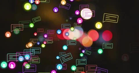 Floating neon speech bubbles with user icons drifting over blurred light circles Stock Photos