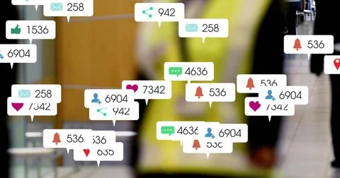 Floating notification bubbles filling transit concourse, surrounding person in Stock Photos