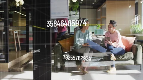 Floating numbers materializing over office and guiding co-workers opening folder Stock Footage 312467366