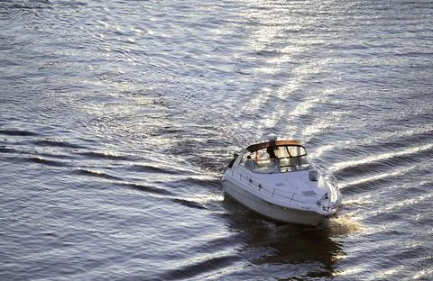 Floating on ocean with small  boat Фото