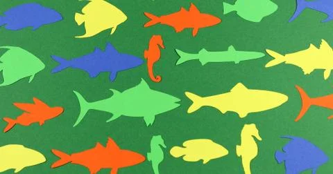 Floating paper colored fish. Stock Photos