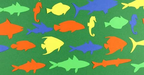 Floating paper colored fish. Stock Photos